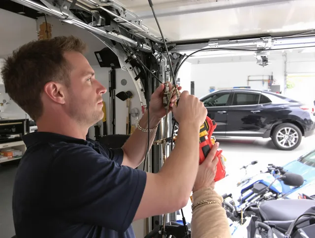 Brunswick Garage Door Repair safety certified technician performing cable replacement in Brunswick