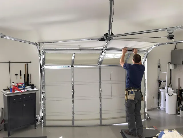Brunswick Garage Door Repair specialist performing precise section replacement on Brunswick garage door